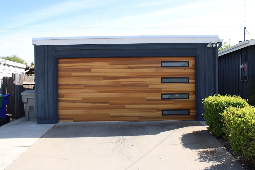About modern-garage-door-with-wood-panels-and-windows-ntzln3hf4fw